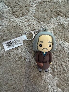 Gray-Haired Character Keychain in Brown Coat